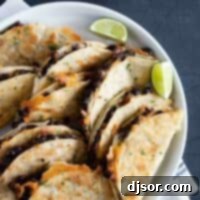 black bean tacos on a plate with lime wedges