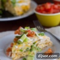 Chicken Tortilla Bake 2 slice of chicken tortilla stack topped with tomatoes and avocado