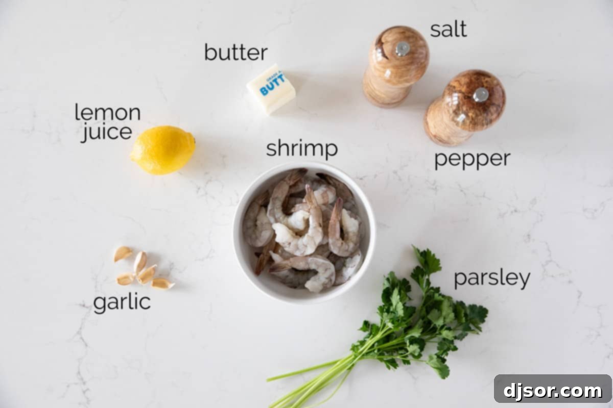 Lemon Garlic Baked Shrimp 3 Fresh ingredients laid out on a wooden board, including raw shrimp, butter, garlic cloves, lemons, salt, pepper, and parsley.