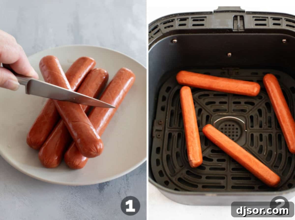 Scoring hot dogs and adding them to an air fryer basket.