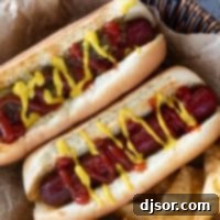 Two Air Fryer Hot Dogs with potato chips.