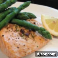 Hazelnut Brown Butter Salmon 2 Grilled Salmon fillets with bright green asparagus and a dollop of hazelnut butter.