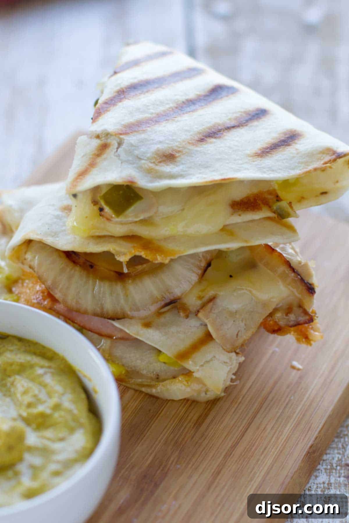 Easy Cuban Quesadilla Delight 5 Stacked triangles of Cuban quesadillas, showcasing the delicious cross-section of fillings.