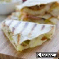 Easy Cuban Quesadilla Delight 6 Sliced Cuban quesadillas on a cutting board.