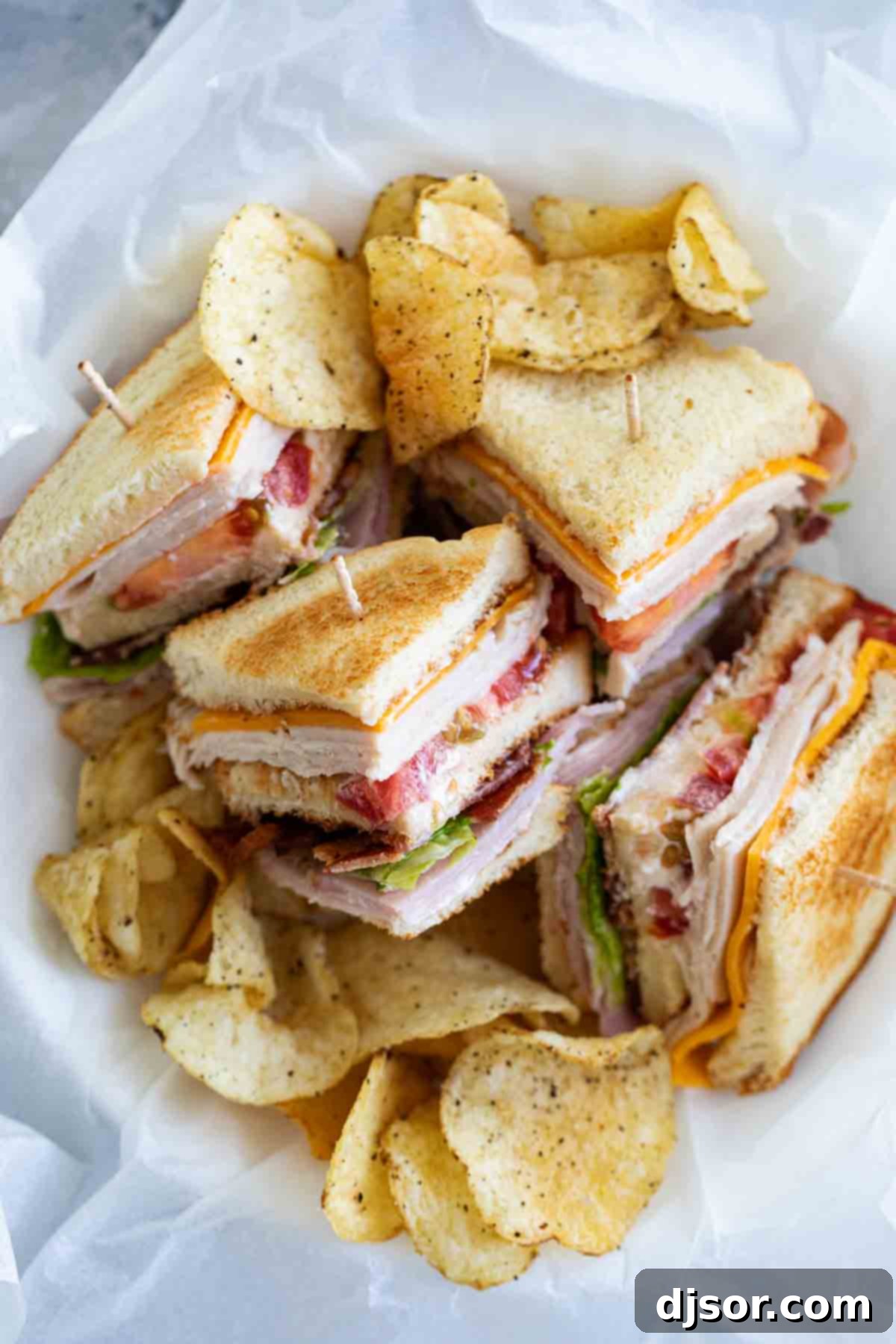overhead view of cut up club sandwich in a basket