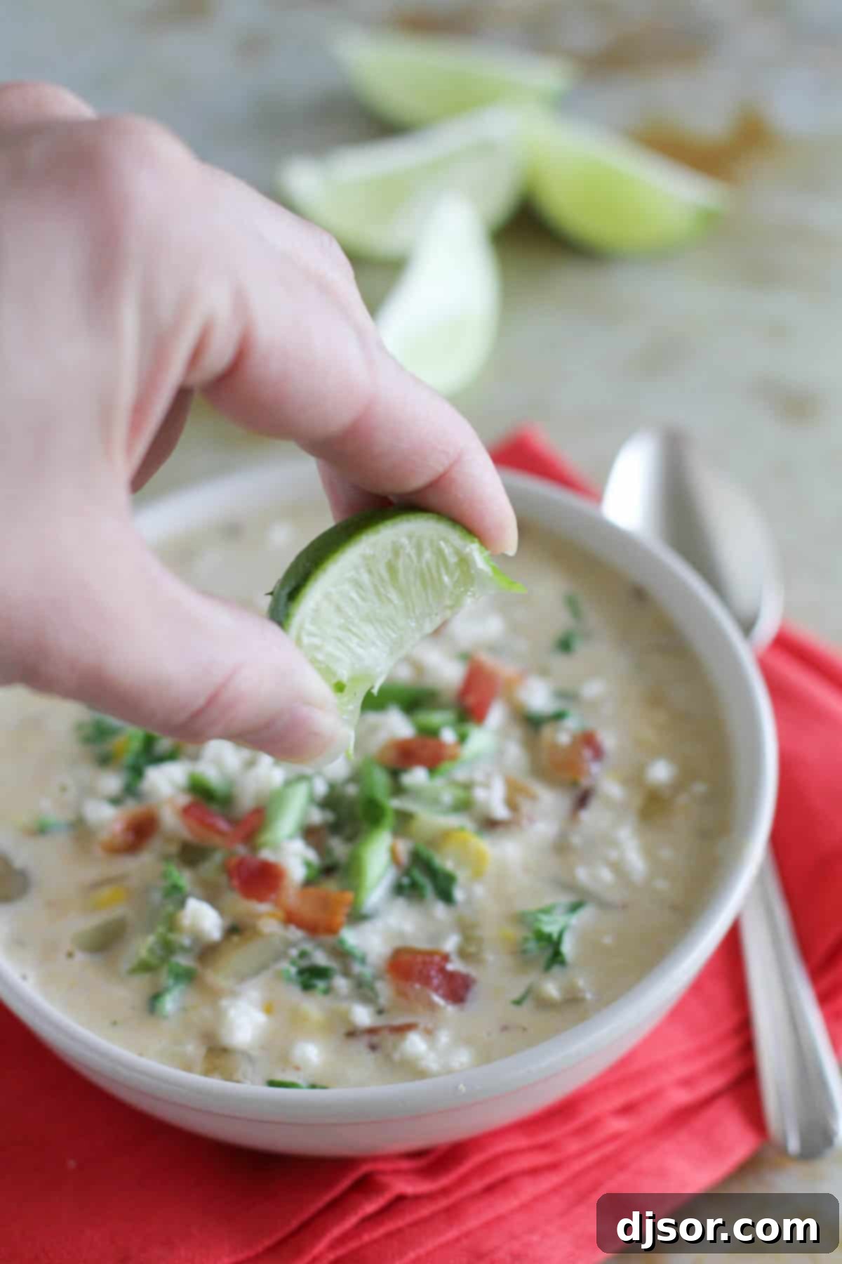 Smoky Chipotle Corn Chowder 3 Squeezing fresh lime into Chipotle Corn Chowder.