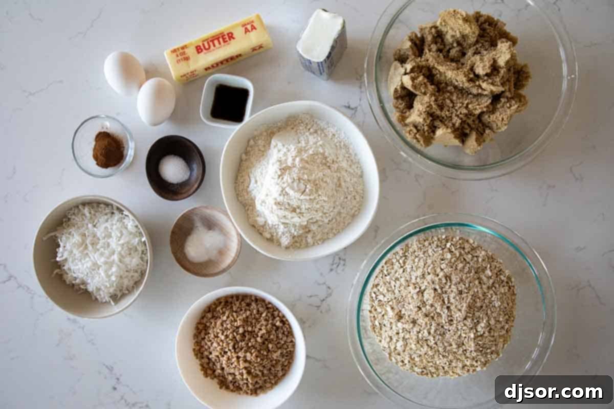 Chewy Coconut Oat Delights 3 Ingredients for Oatmeal Coconut Cookies laid out on a table, including flour, oats, sugar, eggs, butter, coconut, and toffee bits.