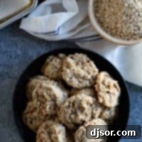 Chewy Coconut Oat Delights 10 Overhead view of oatmeal coconut cookies, garnished beautifully.