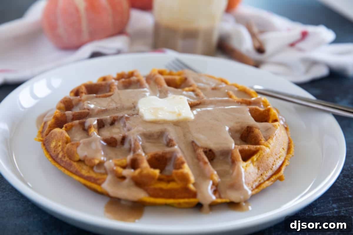 Autumn Pumpkin Waffles 2 Perfectly golden Pumpkin Waffles, served warm and ready to be enjoyed with a dollop of butter and a drizzle of cinnamon syrup. Ideal for a quintessential fall breakfast.