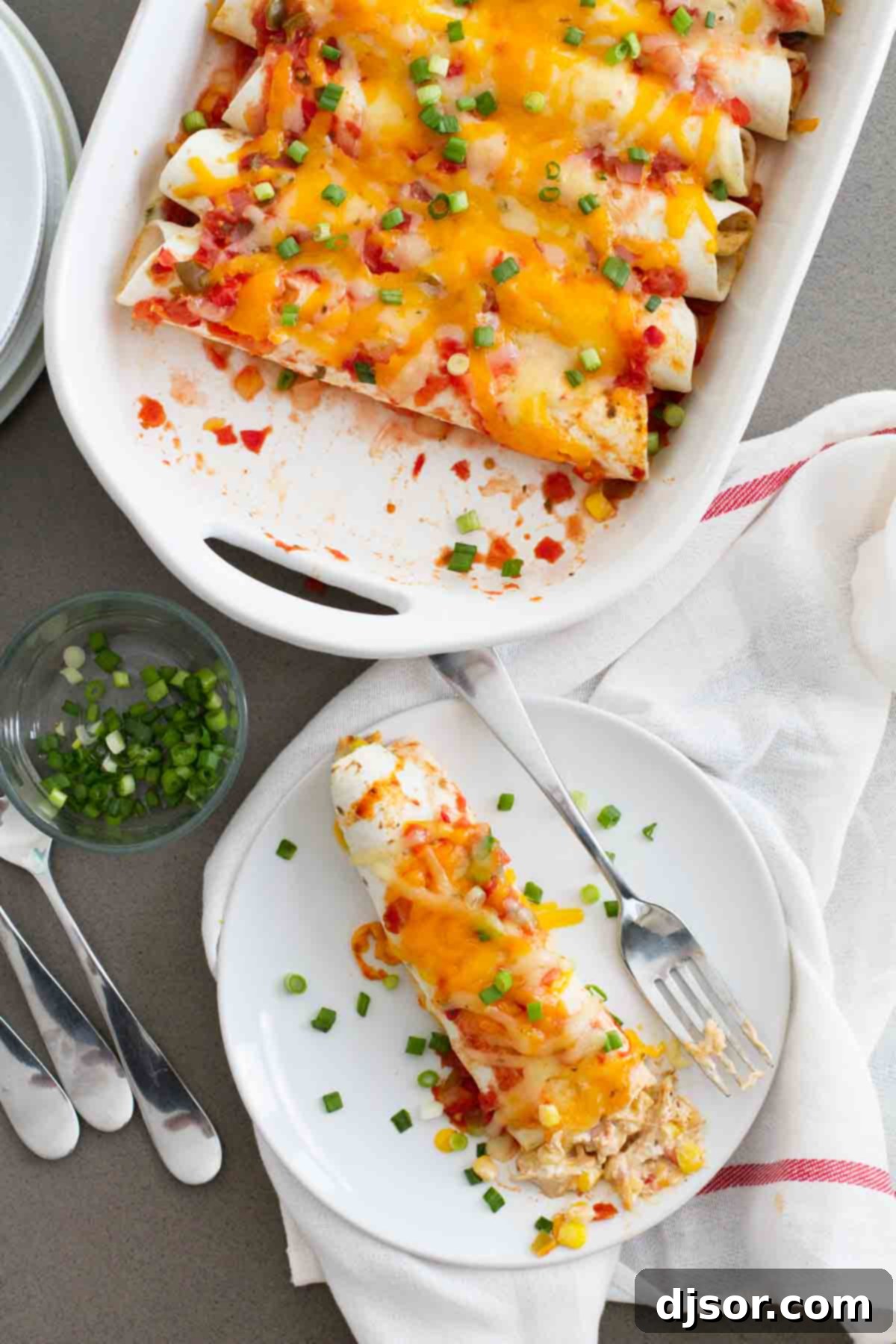 Creamy Chicken Enchilada Bake 4 A full casserole dish of Cream Cheese Chicken Enchiladas next to a single serving on a plate, highlighting their delicious appearance.