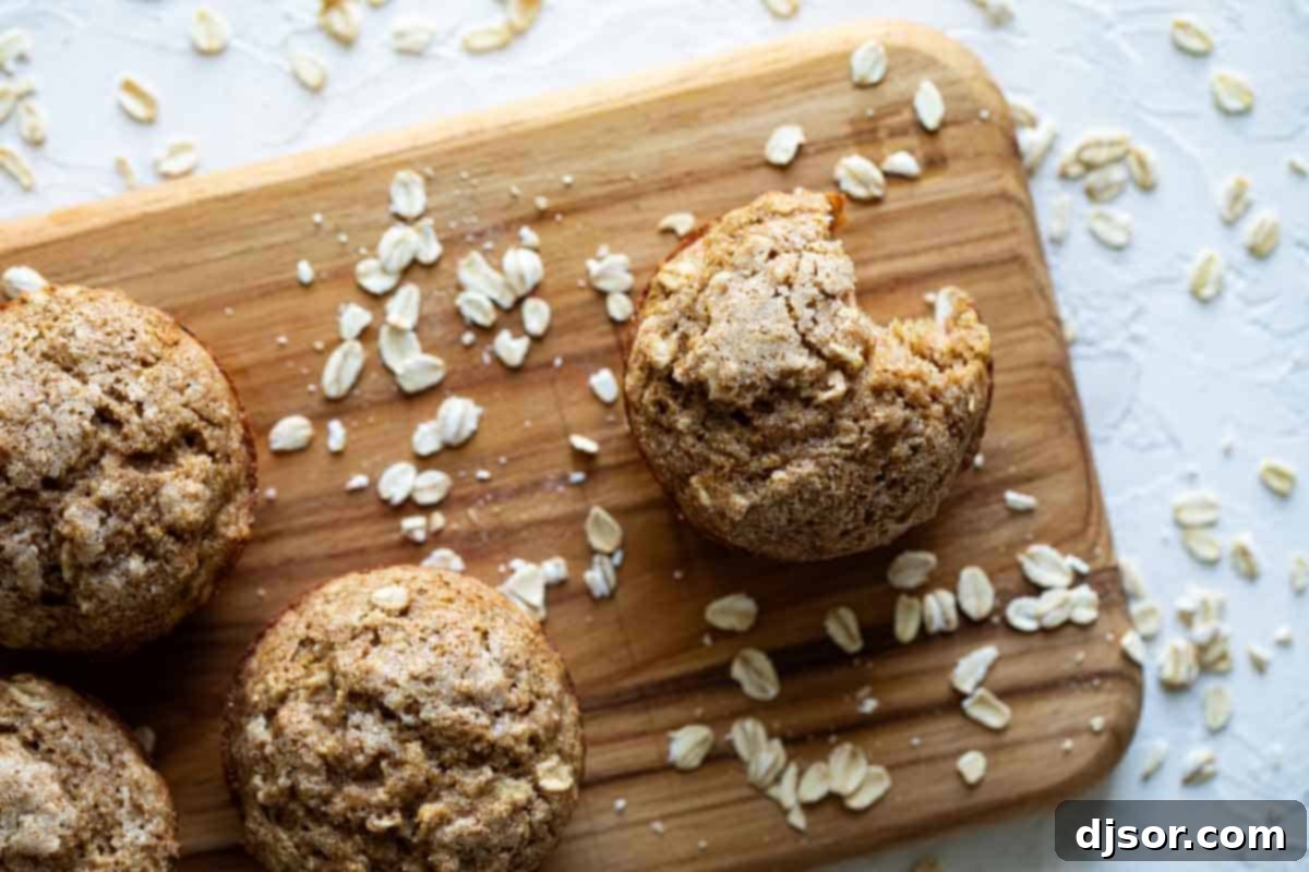 Golden Oatmeal Muffin Tops with Sugar Sprinkles Close-up of the tops of golden-brown oatmeal muffins, sprinkled with a hint of sugar and visible oats.