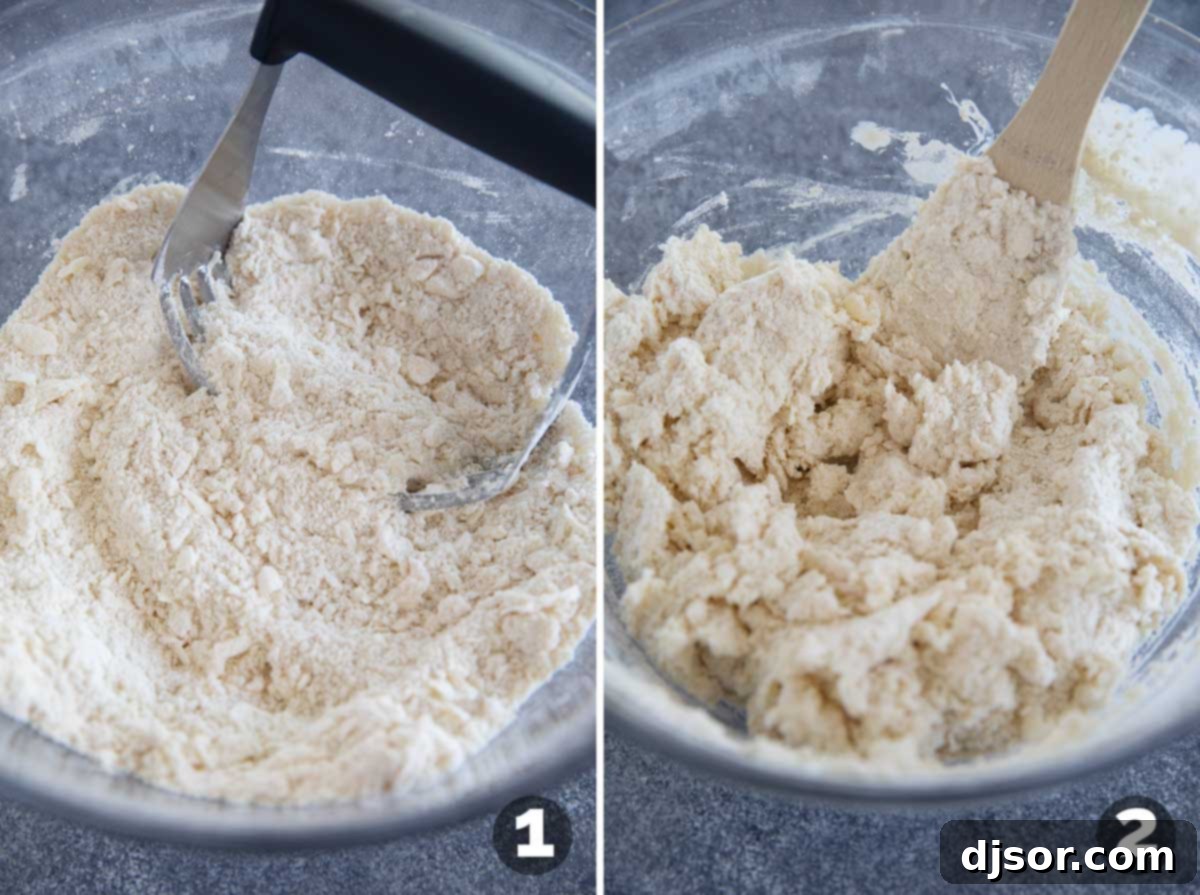 Close-up of butter being cut into dry ingredients in a bowl for Jalapeno Cheddar Biscuits.