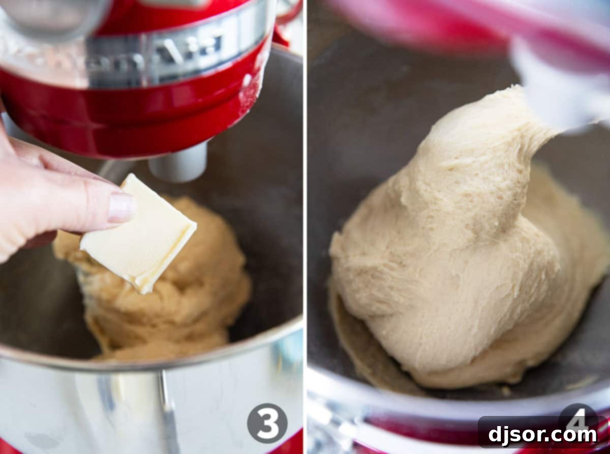 Close-up of butter being added gradually to brioche dough in a stand mixer.