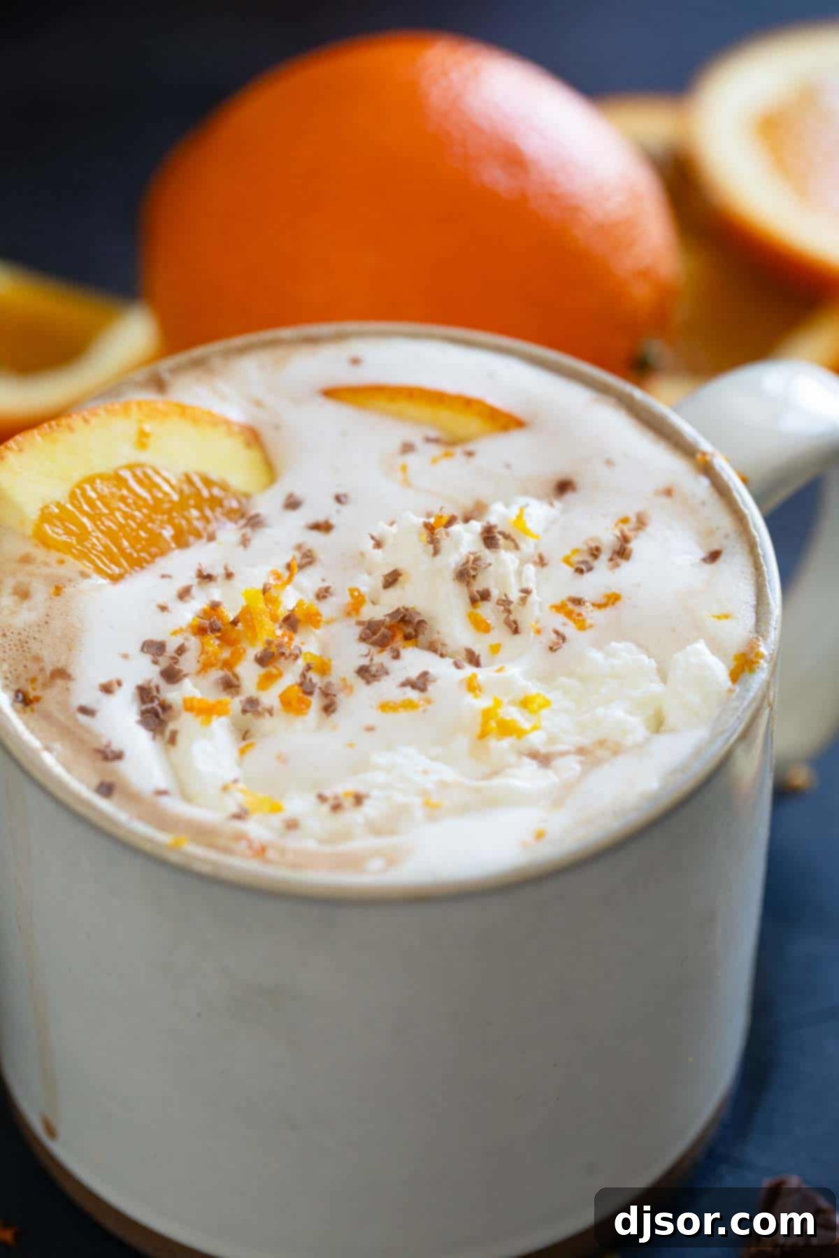 Orange hot chocolate made with milk, chocolate, orange zest, and orange juice.