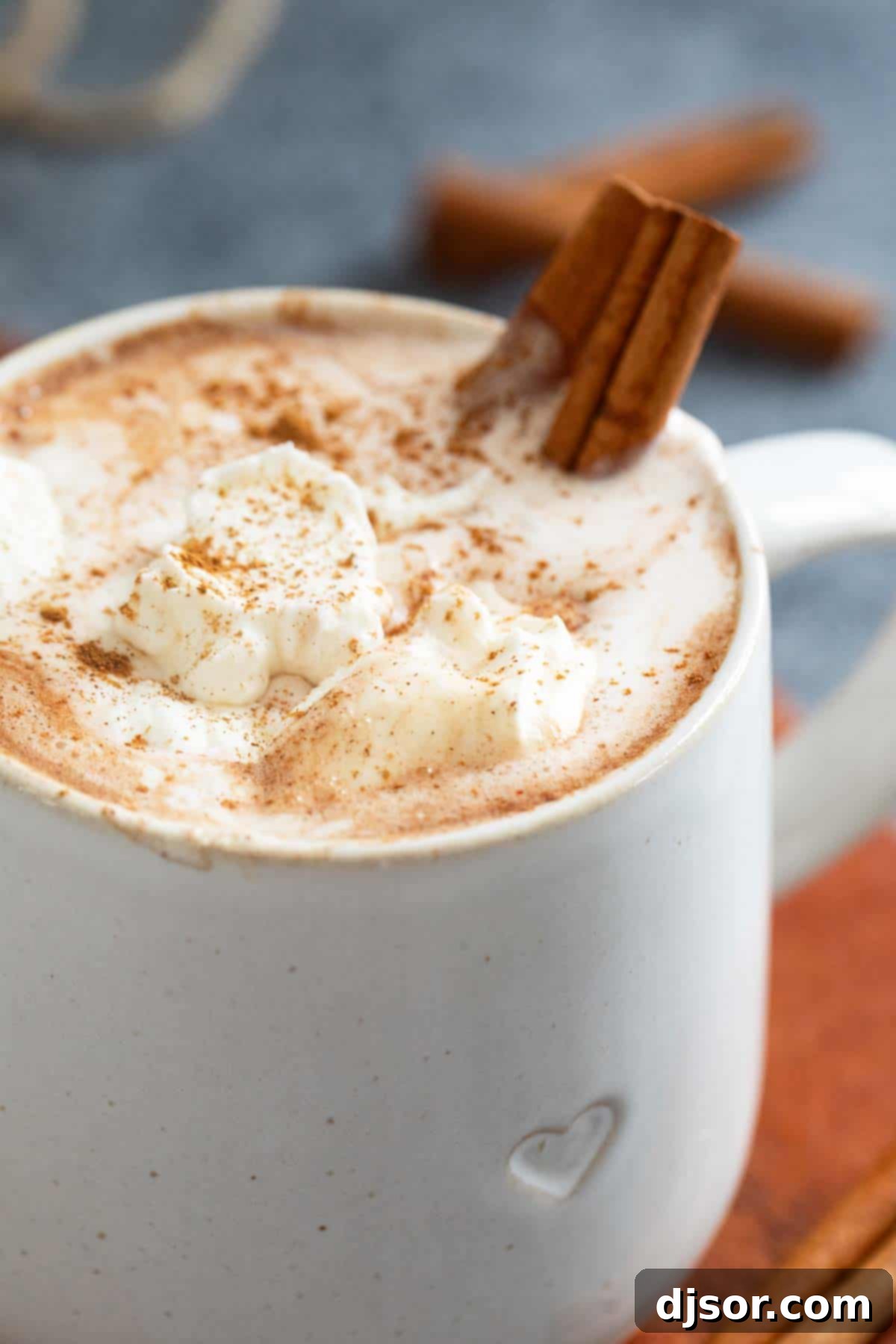 Velvety Mexican Spiced Chocolate 6 Mexican Hot Chocolate topped with a generous swirl of whipped cream and a dusting of cinnamon, inviting to sip.