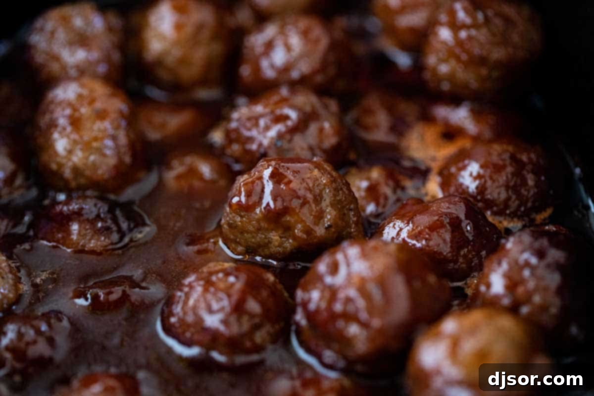 BBQ Grape Jelly Meatballs in a crockpot, ready to serve at a party.