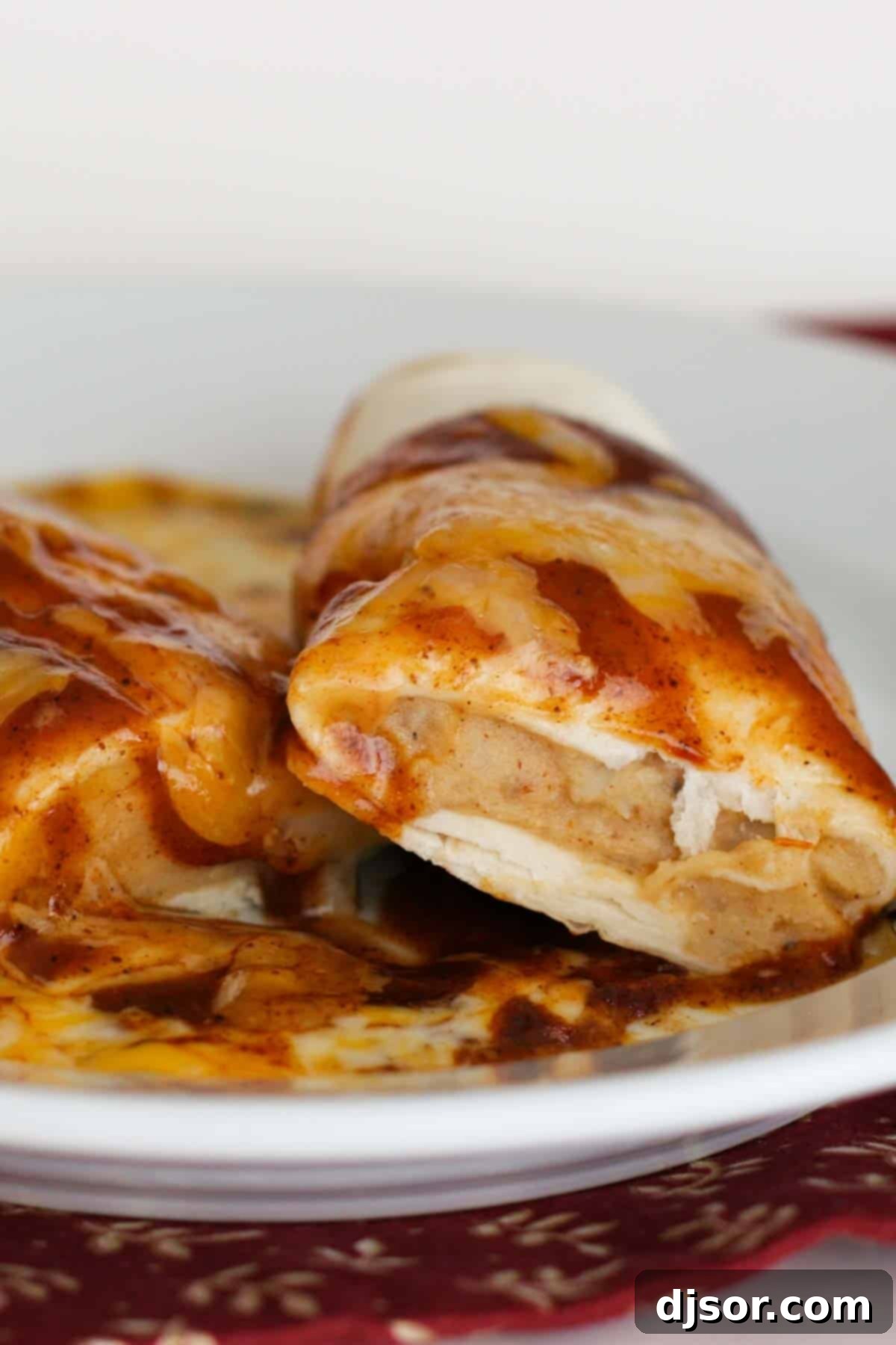 Chili Potato Burrito cut open to show the mashed potato and spice filling.