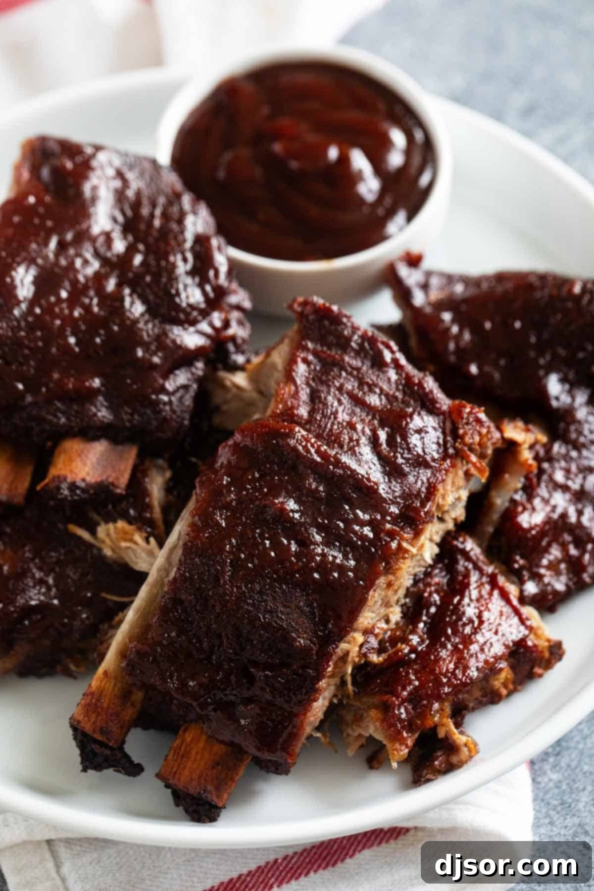 Succulent Slow Cooker Ribs covered in rich bbq sauce, ready to serve.