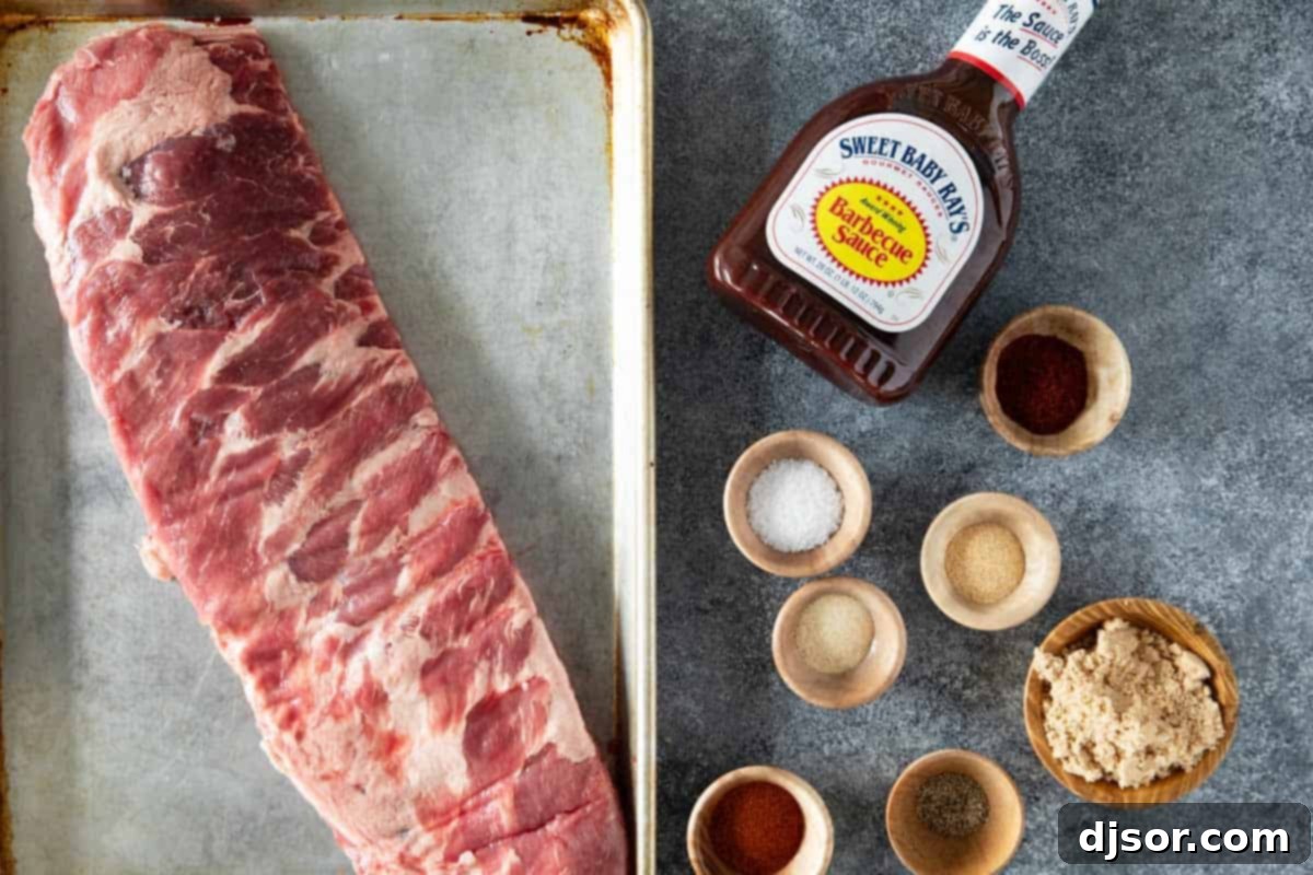 A collection of fresh ingredients laid out for making Slow Cooker Ribs, including spices, a rack of ribs, and a bottle of BBQ sauce.