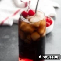 Roy Rogers Drink with grenadine and cola and maraschino cherries.