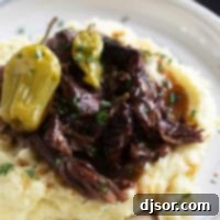Mississippi Magic Pot Roast 7 Mississippi Pot Roast over mashed potatoes with pepperoncini peppers.