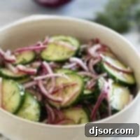Refreshing Cucumber and Onion Salad 7 Bowl with Cucumber Onion Salad with fresh dill and salt and pepper.