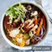 Burger Bowls with beef, sweet potato fries, onions, tomatoes, cheese, bacon, and more.