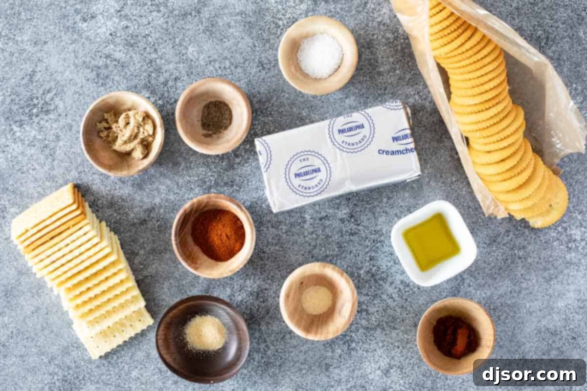 A selection of ingredients laid out for making smoked cream cheese, including a block of cream cheese, spices, and olive oil.