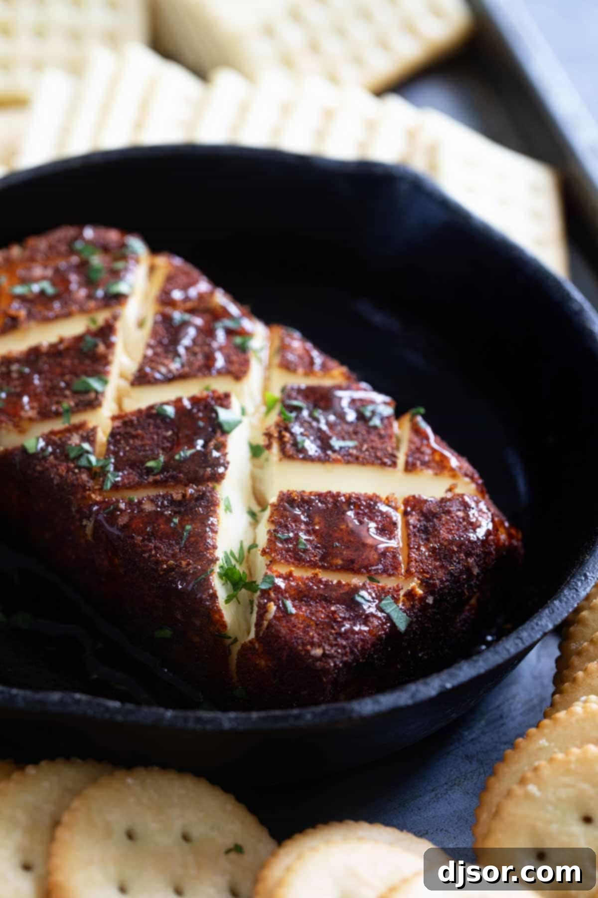 Finished smoked cream cheese drizzled with hot honey and garnished with fresh parsley, ready for serving.