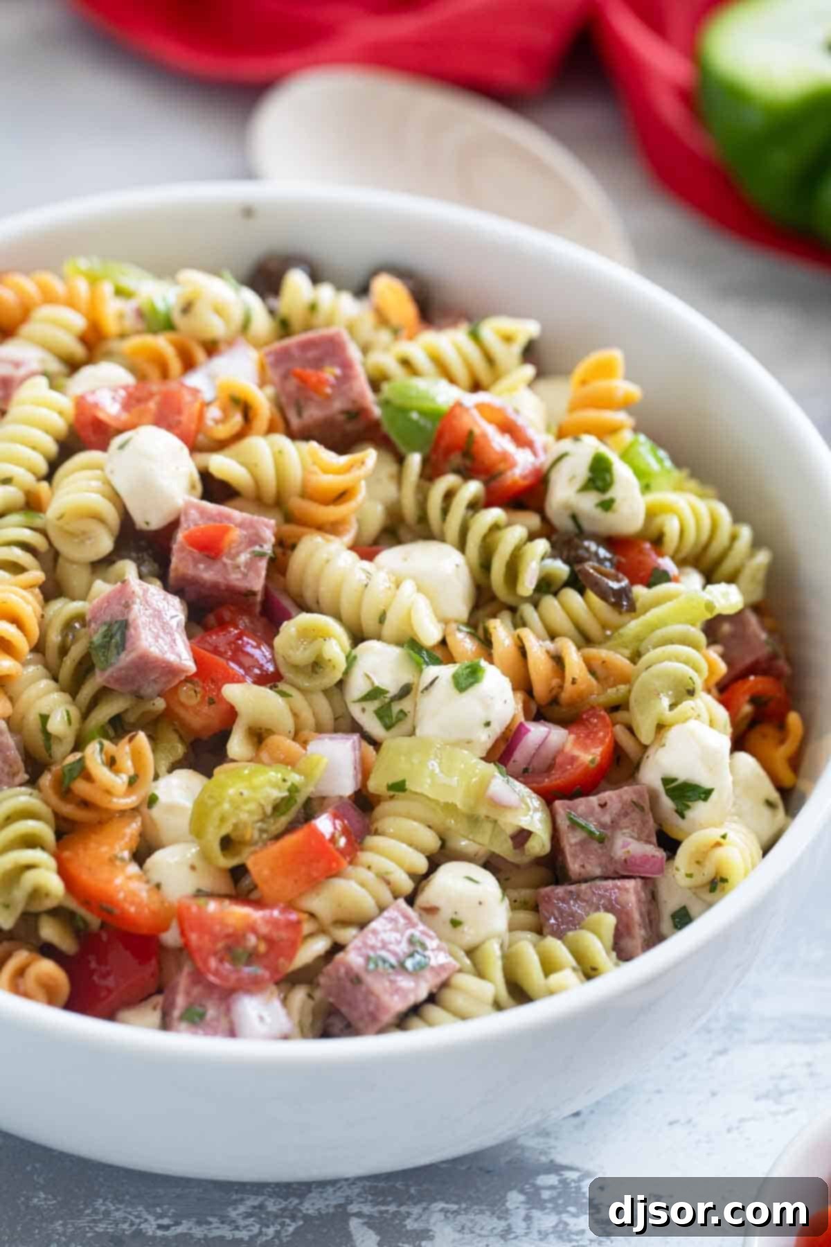 Bowl filled with Italian Pasta Salad with rotini pasta.