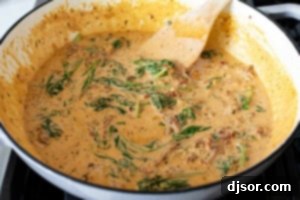 Making cream sauce for Tuscan Salmon.