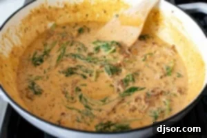 Making cream sauce for Tuscan Salmon.