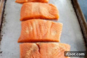 Seasoning salmon fillets.