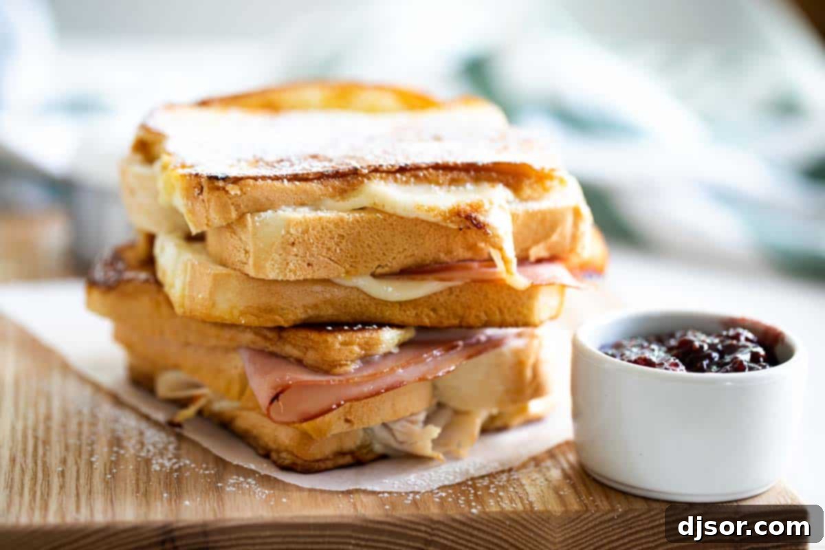 2 full monte cristo sandwiches stacked on top of each other