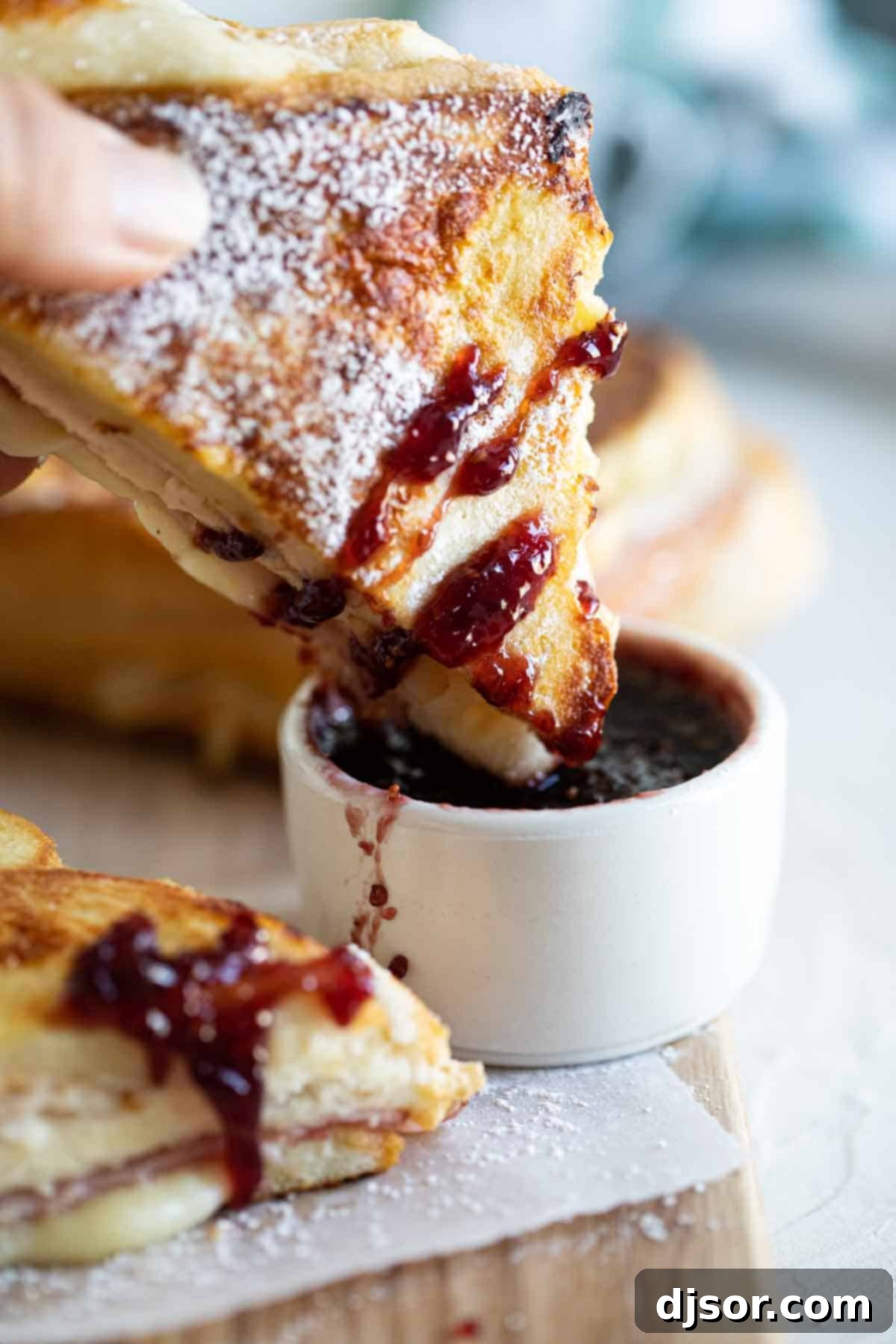 Dipping a Monte Cristo Sandwich into Jam