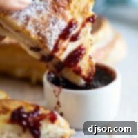 Dipping a Monte Cristo Sandwich into Jam