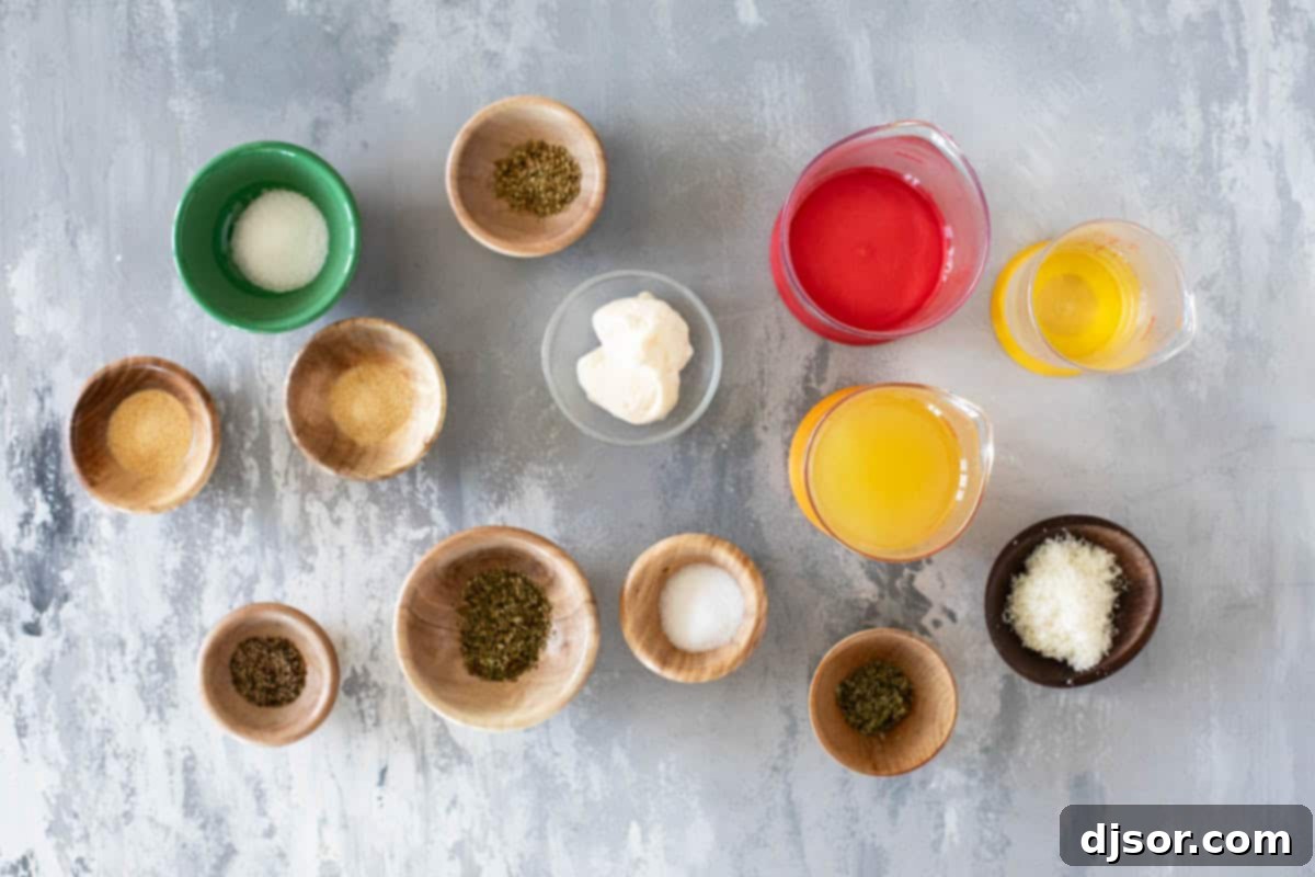 Assorted ingredients for making copycat Olive Garden Salad Dressing, including olive oil, vinegar, mayonnaise, Parmesan, and various spices laid out on a wooden surface.