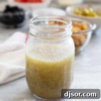 Homemade Olive Garden Salad Dressing in an elegant mason jar.