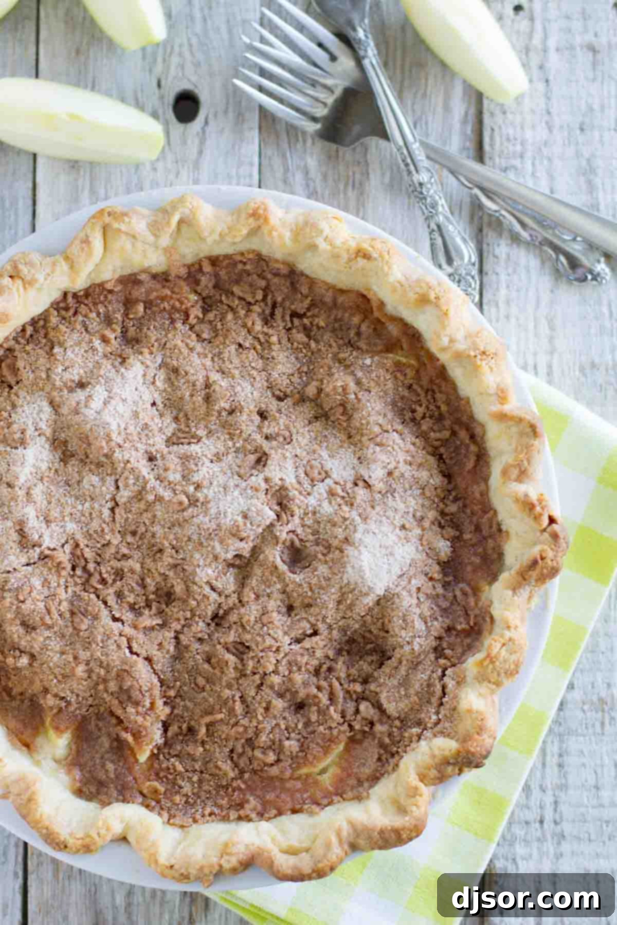 A whole Sour Cream Apple Pie, generously covered with a golden-brown streusel topping. Whole Apple Pie with Crumble Topping