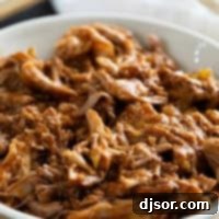 Bowl with Cafe Rio Sweet Pork on a cutting board.