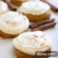 Cream Cheese Frosted Pumpkin Spice Cookies 9 Soft Pumpkin Cookies with Cream Cheese Frosting with cinnamon dusted on top of cookies.