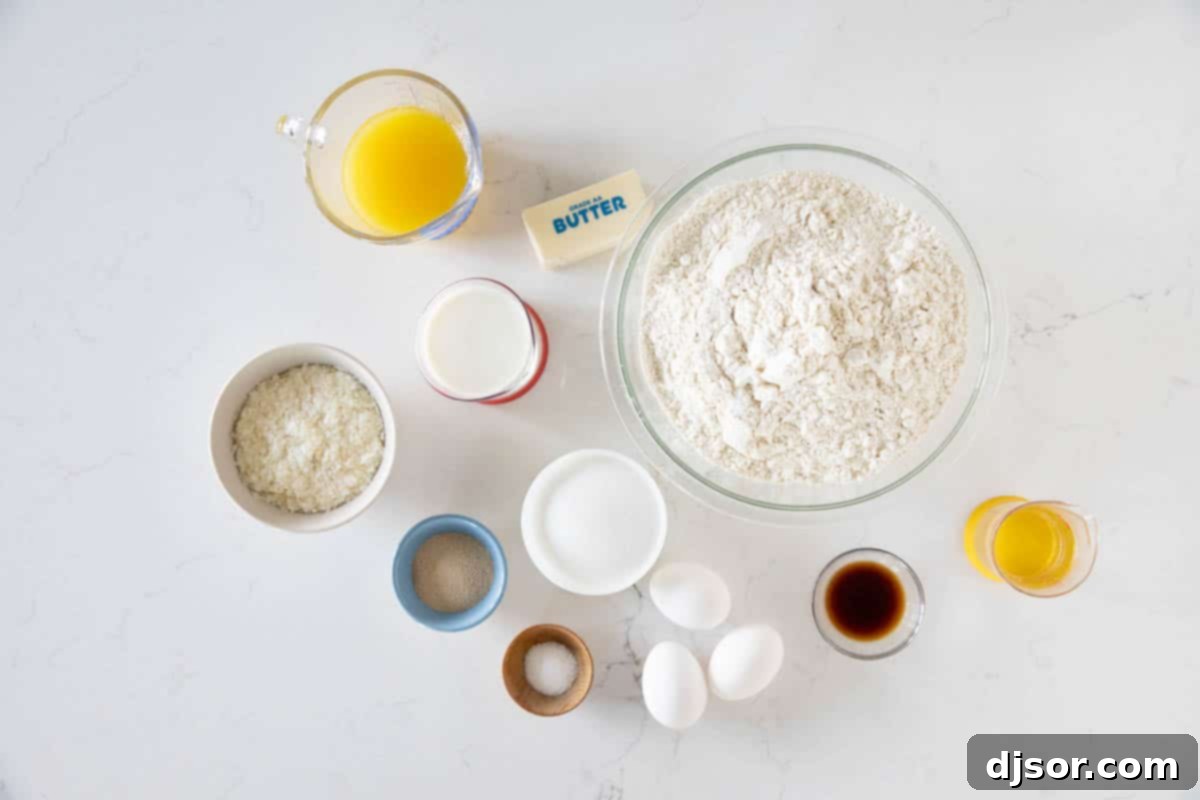 Soft and slightly sweet, this Hawaiian Bread is the perfect side dish to any Hawaiian meal. Serve it up as a side with butter, and save a loaf for French toast the next day! All the essential ingredients for baking Hawaiian Bread laid out on a kitchen counter, ready for preparation.