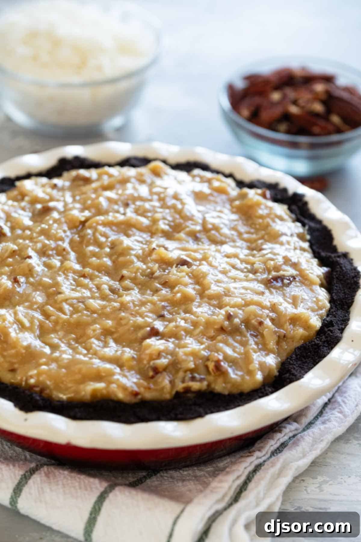 German Chocolate Indulgence 8 A whole German Chocolate Pie in a pie plate, freshly made and ready to be served.