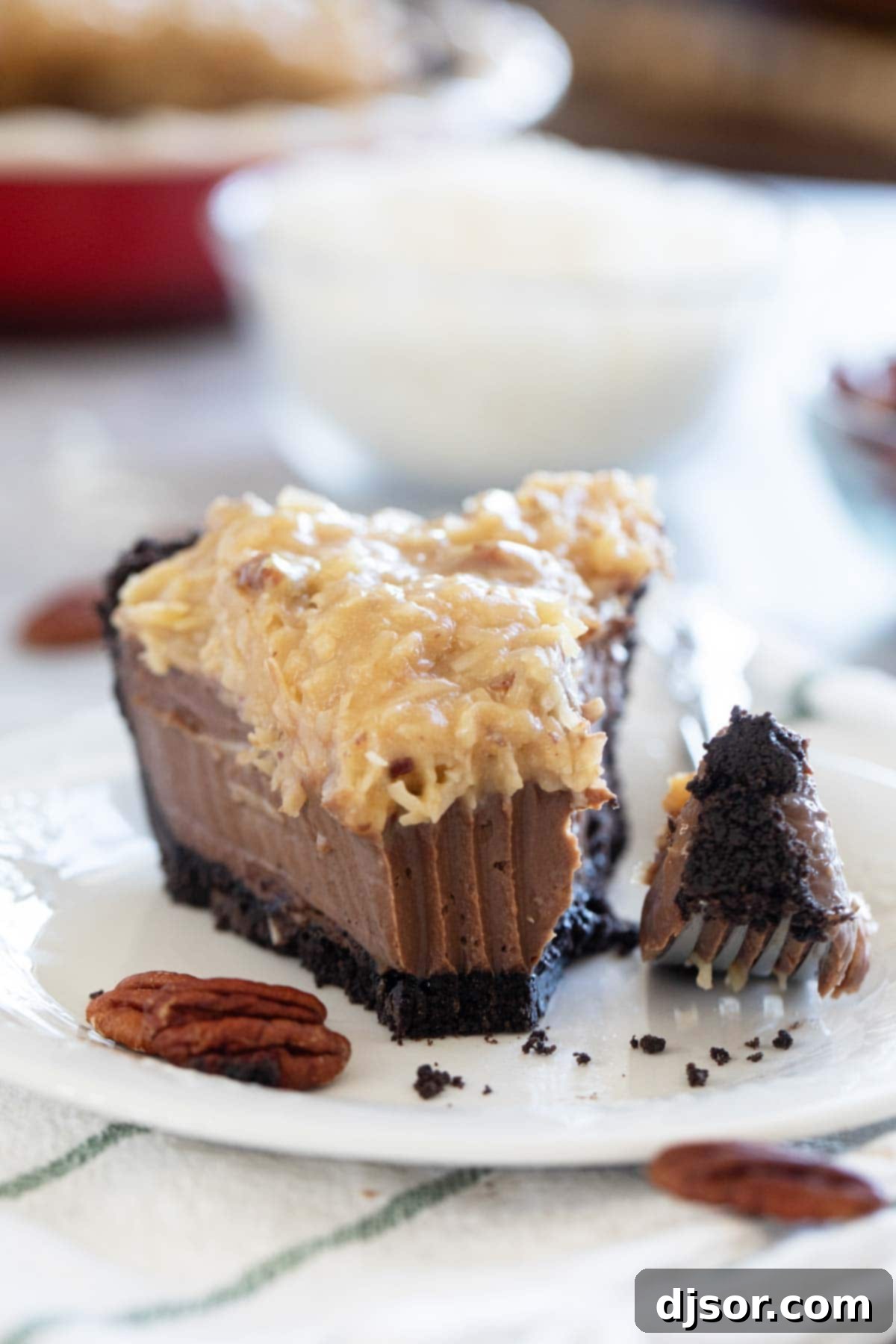German Chocolate Indulgence 9 A slice of German Chocolate Pie, with a bite taken, revealing its moist filling and crunchy topping.