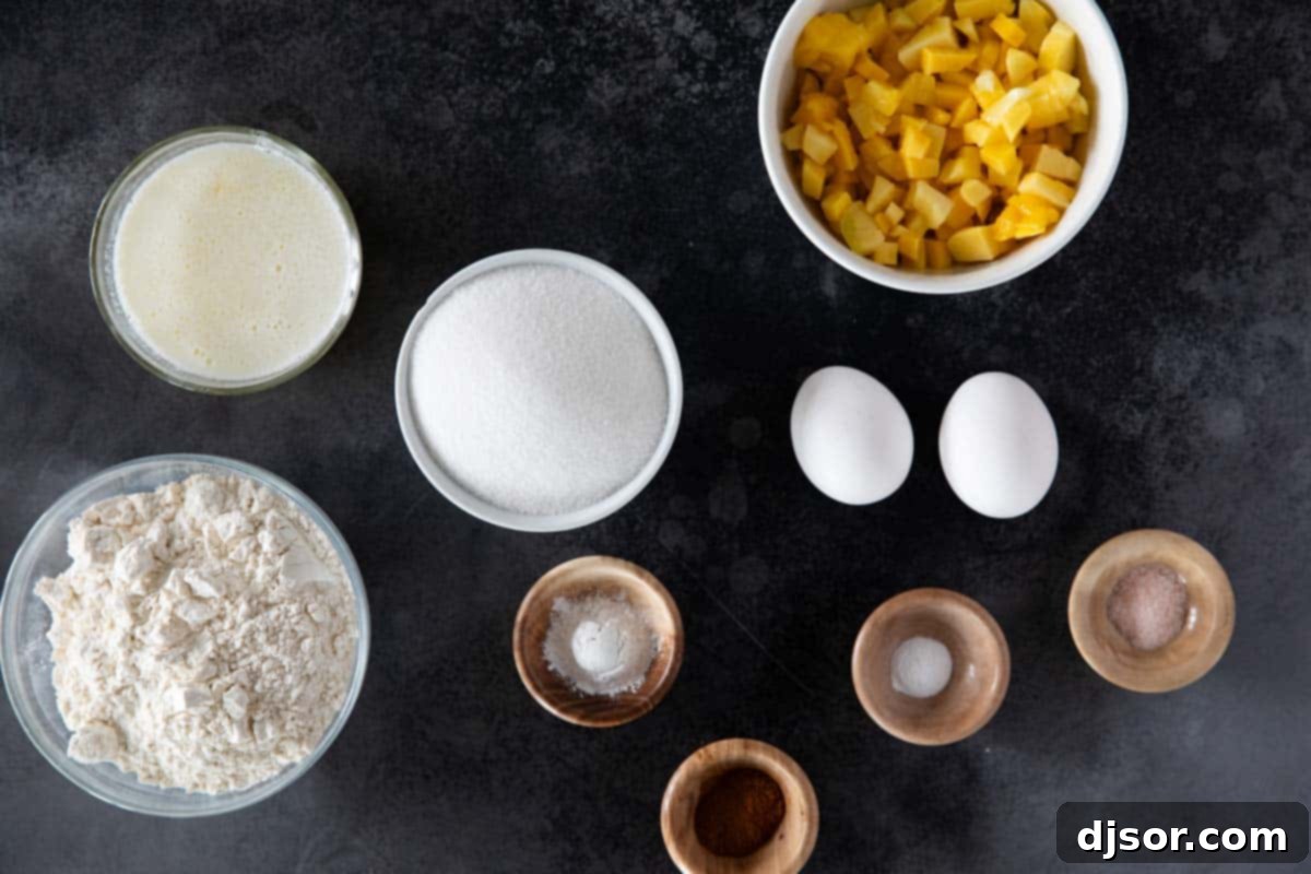 Various ingredients laid out for making Mango Bread, including flour, sugar, eggs, butter, and fresh mango.