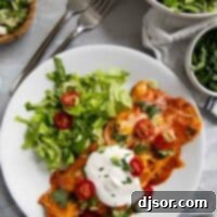 Cheesy Beef Enchilada Bake 11 Ground beef enchiladas topped with sour cream tomatoes, and cilantro.