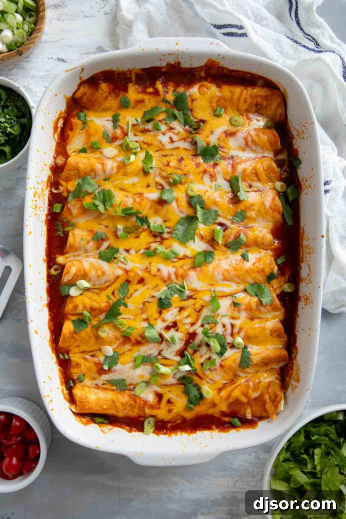Cheesy Beef Enchilada Bake 8 A steaming casserole dish filled with golden-baked ground beef enchiladas, fresh out of the oven.