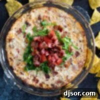BLT Dip topped with lettuce and tomatoes