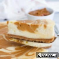 slice of dulce de leche cheesecake being taken from the full cheesecake.