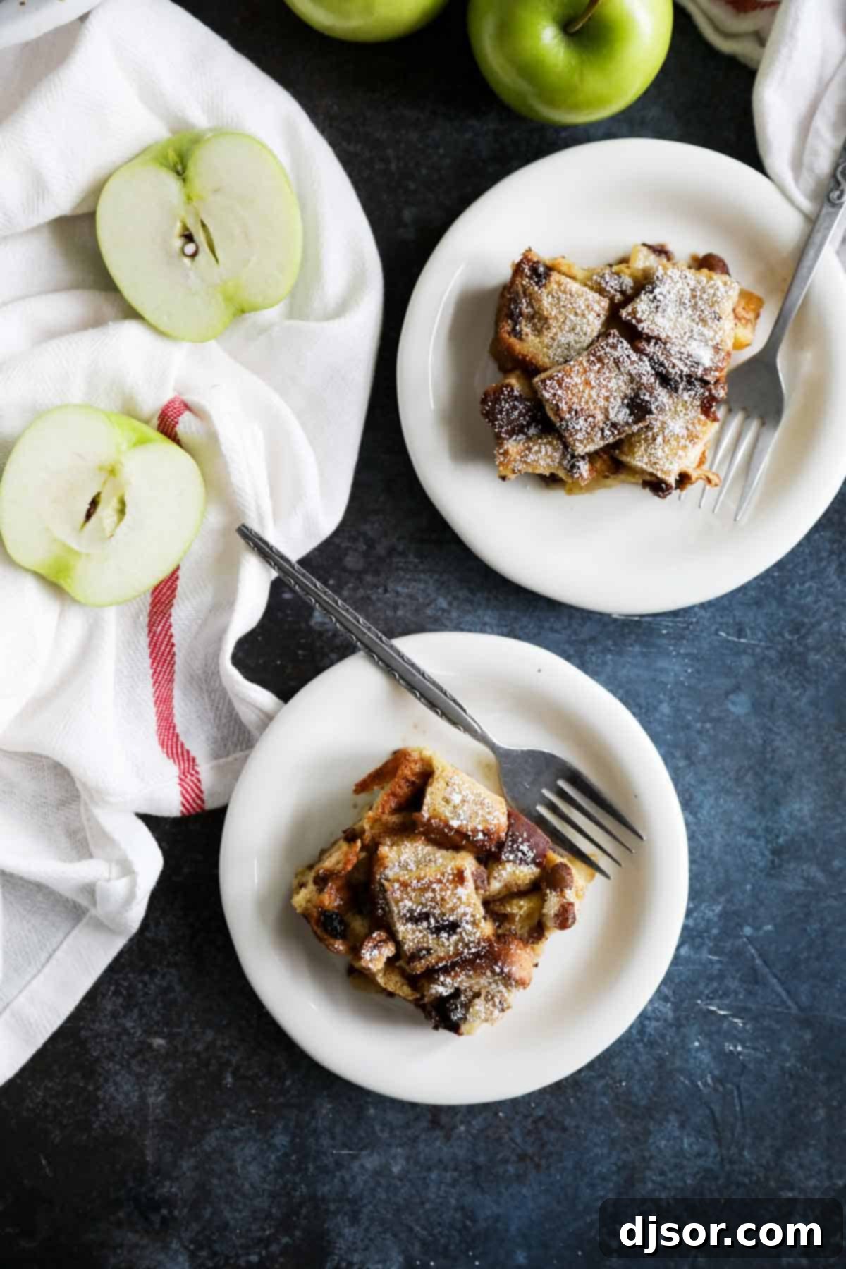 Servings of baked French Toast Casserole with apples on plates.